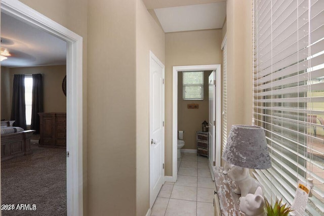 18309 N Crestview Ln, Maricopa, AZ 85138 - hall featuring healthy amount of natural light, light tile patterned flooring, and baseboards