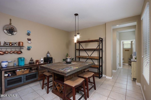 18309 N Crestview Ln, Maricopa, AZ 85138 - dining space featuring light tile patterned floors and baseboards