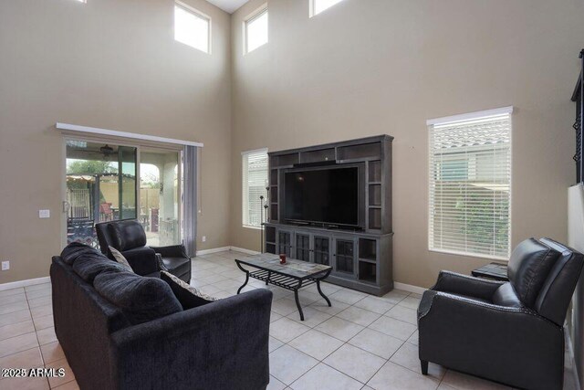18309 N Crestview Ln, Maricopa, AZ 85138 - living area featuring a high ceiling, light tile patterned flooring, and baseboards