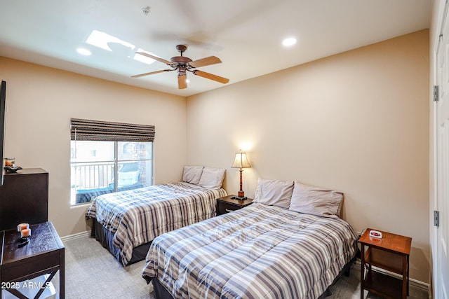 5350 E Deer Valley Dr Unit 2246, Phoenix, AZ 85054 - bedroom with a skylight, recessed lighting, a ceiling fan, light carpet, and baseboards