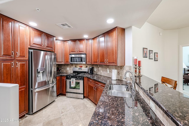 5350 E Deer Valley Dr Unit 2246, Phoenix, AZ 85054 - kitchen featuring stainless steel appliances, a sink, visible vents, and decorative backsplash