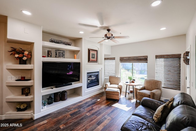 5350 E Deer Valley Dr Unit 2246, Phoenix, AZ 85054 - living area with recessed lighting, built in shelves, dark wood finished floors, and a glass covered fireplace