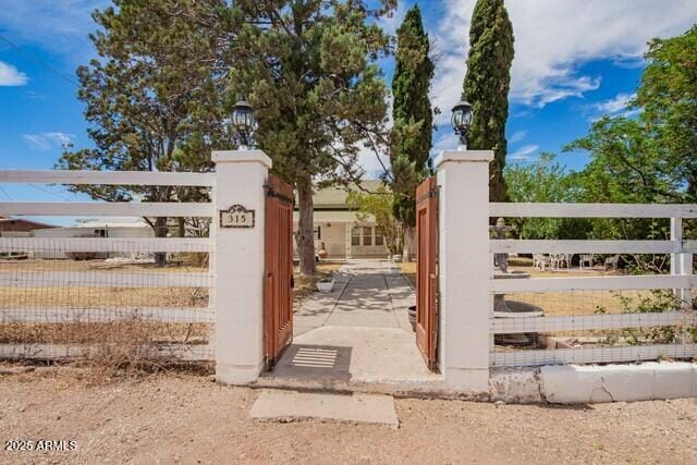 315 N 4th St, Tombstone, AZ 85638 - view of gate featuring a fenced front yard