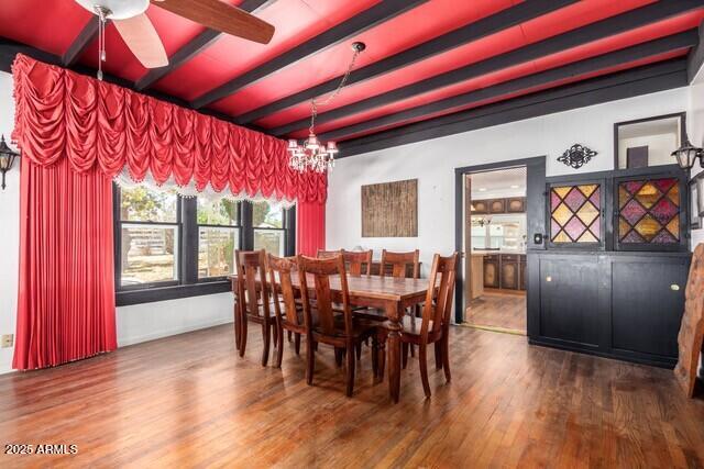 315 N 4th St, Tombstone, AZ 85638 - dining area with beamed ceiling, ceiling fan with notable chandelier, and wood finished floors