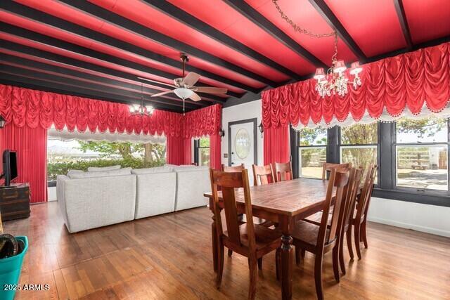 315 N 4th St, Tombstone, AZ 85638 - dining room with beam ceiling, wood finished floors, and a chandelier