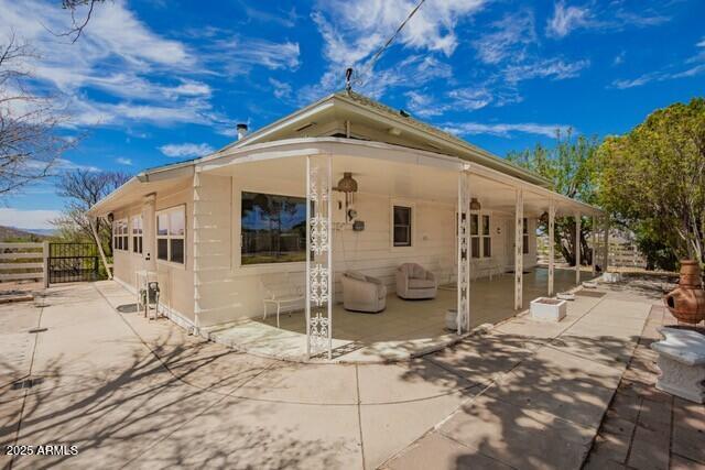 315 N 4th St, Tombstone, AZ 85638 - view of side of property featuring fence and a patio area