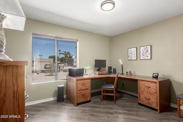 office featuring dark wood-type flooring and baseboards