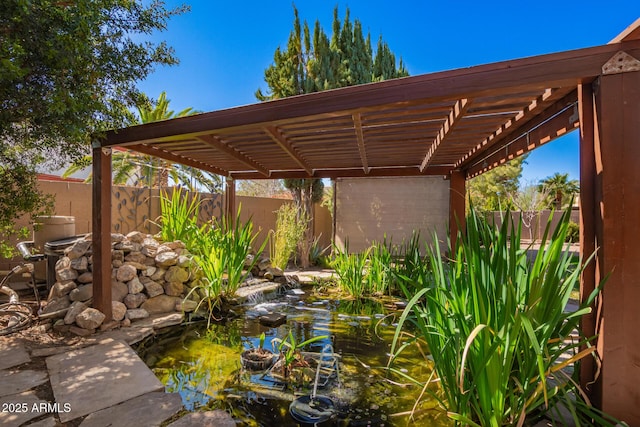 view of patio / terrace featuring a fenced backyard and a pergola