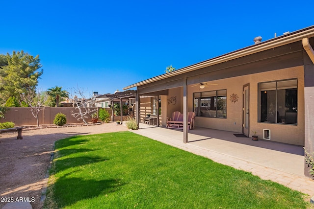 view of yard featuring a ceiling fan, a patio area, fence, and a pergola