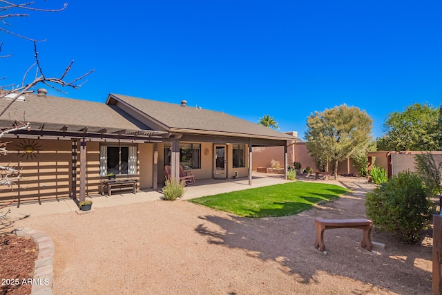 back of property featuring a patio, fence private yard, and stucco siding