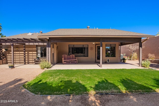 back of property featuring roof with shingles, a yard, a patio, stucco siding, and a pergola