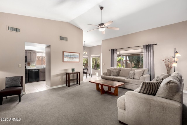 living room with a ceiling fan, visible vents, light carpet, and baseboards