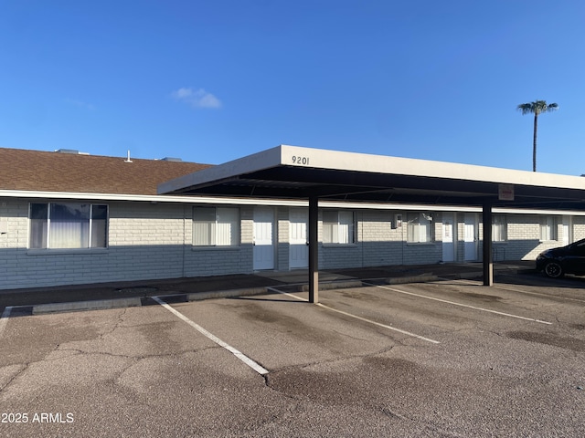 view of parking / parking lot with a carport