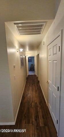 hallway with dark hardwood / wood-style floors