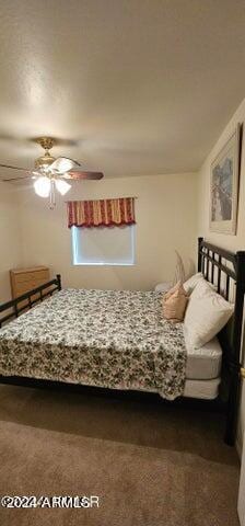 unfurnished bedroom featuring dark colored carpet and ceiling fan