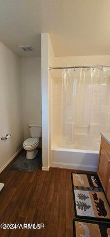 full bathroom featuring vanity, toilet, shower / bath combo, and hardwood / wood-style flooring