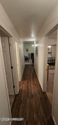 corridor with dark hardwood / wood-style floors