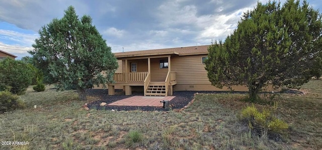 rear view of property with a deck