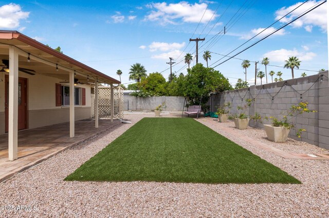 7250 E Mckellips Rd, Scottsdale, AZ 85257 - view of yard featuring ceiling fan and a patio area