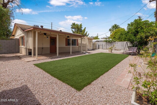 7250 E Mckellips Rd, Scottsdale, AZ 85257 - view of yard featuring a ceiling fan and a patio area