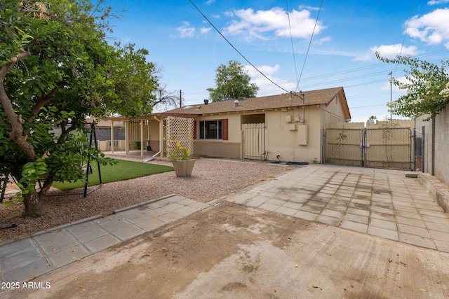 7250 E Mckellips Rd, Scottsdale, AZ 85257 - rear view of property with a gate and a patio