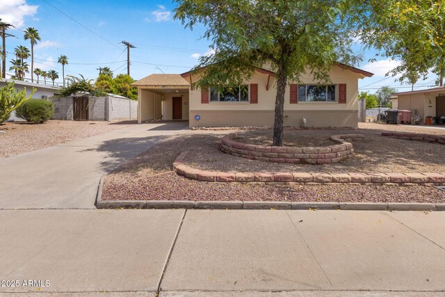 7250 E Mckellips Rd, Scottsdale, AZ 85257 - ranch-style home with concrete driveway and a carport