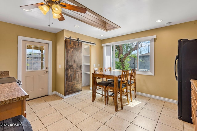 7250 E Mckellips Rd, Scottsdale, AZ 85257 - dining room with a barn door, baseboards, ceiling fan, light tile patterned floors, and recessed lighting