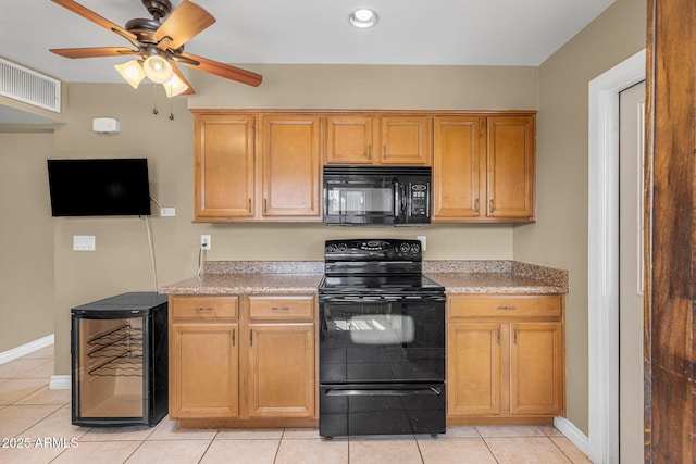 7250 E Mckellips Rd, Scottsdale, AZ 85257 - kitchen with black appliances, wine cooler, light tile patterned floors, baseboards, and recessed lighting