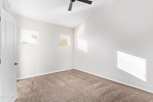 unfurnished room with ceiling fan, lofted ceiling, and carpet flooring