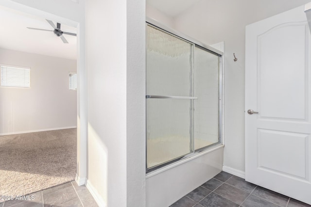 bathroom with combined bath / shower with glass door, tile patterned floors, and ceiling fan