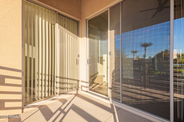 exterior space with ceiling fan