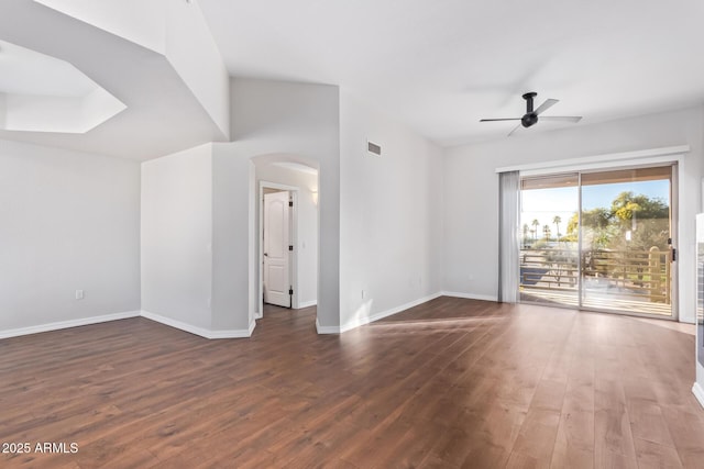 spare room featuring ceiling fan and dark hardwood / wood-style floors