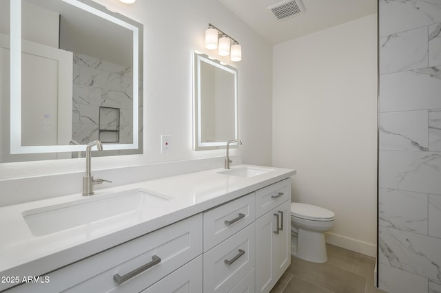 bathroom featuring vanity, wood-type flooring, and toilet