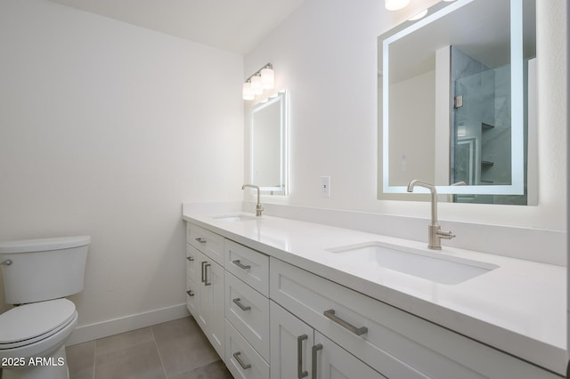 bathroom featuring walk in shower, vanity, toilet, and tile patterned flooring