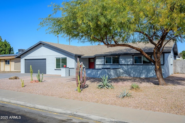 ranch-style home with a garage