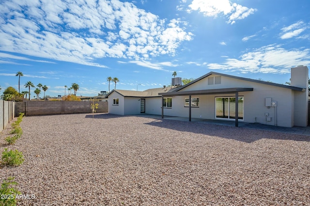 back of house with a patio