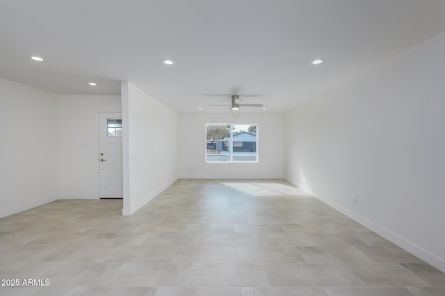 spare room with ceiling fan