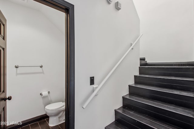 staircase with wood finished floors