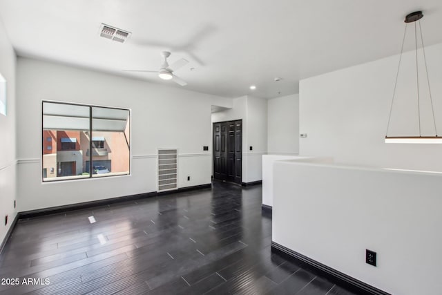 unfurnished room with ceiling fan, dark wood-style flooring, baseboards, and recessed lighting