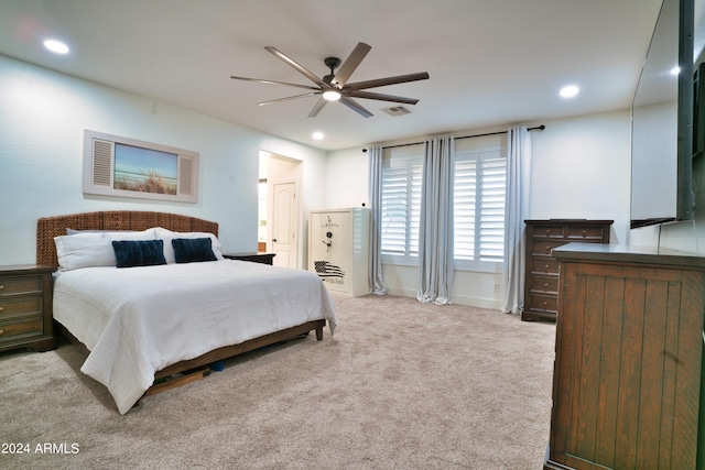 bedroom featuring ceiling fan and light carpet