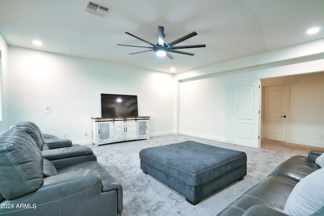 carpeted living room featuring ceiling fan