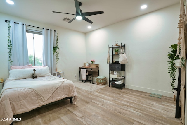 bedroom featuring ceiling fan and light hardwood / wood-style flooring