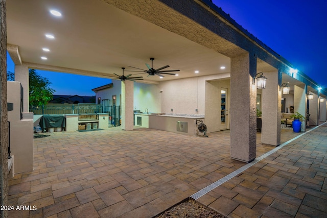 view of patio featuring area for grilling and ceiling fan