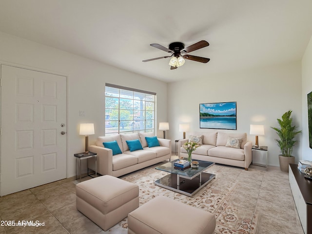 tiled living room with ceiling fan