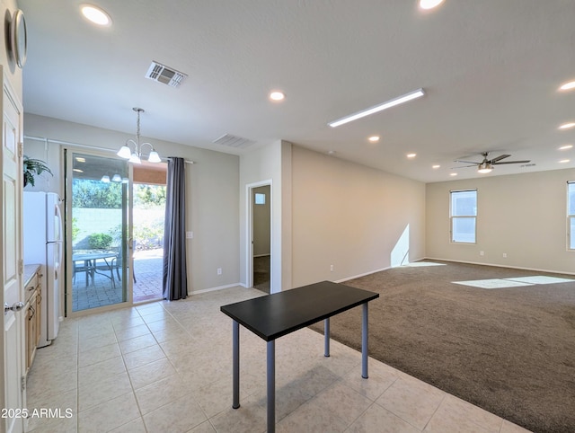 recreation room featuring ceiling fan with notable chandelier and light carpet