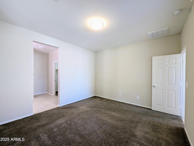 unfurnished room featuring carpet floors