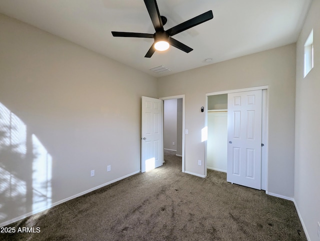 unfurnished bedroom with carpet, ceiling fan, and a closet