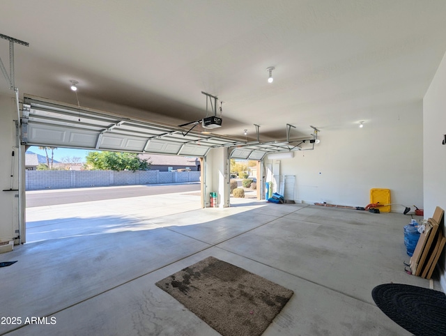 garage featuring a garage door opener