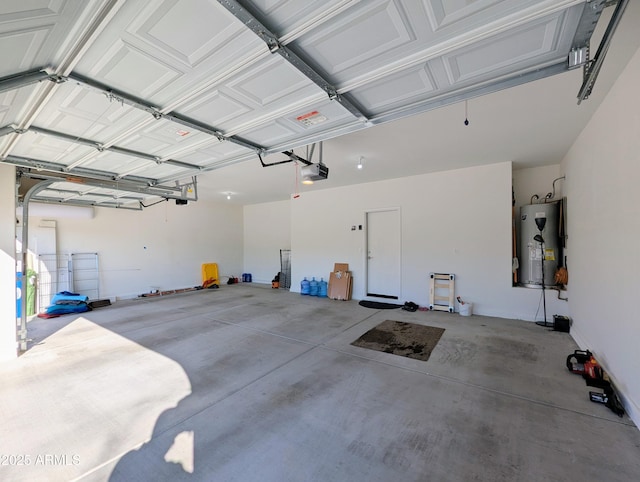 garage with a garage door opener and electric water heater