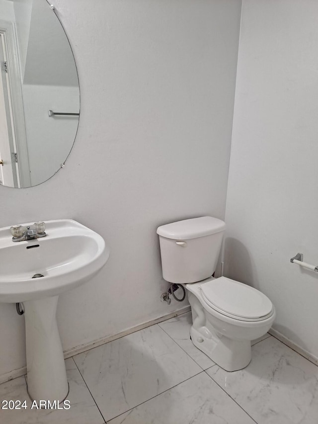 bathroom featuring toilet